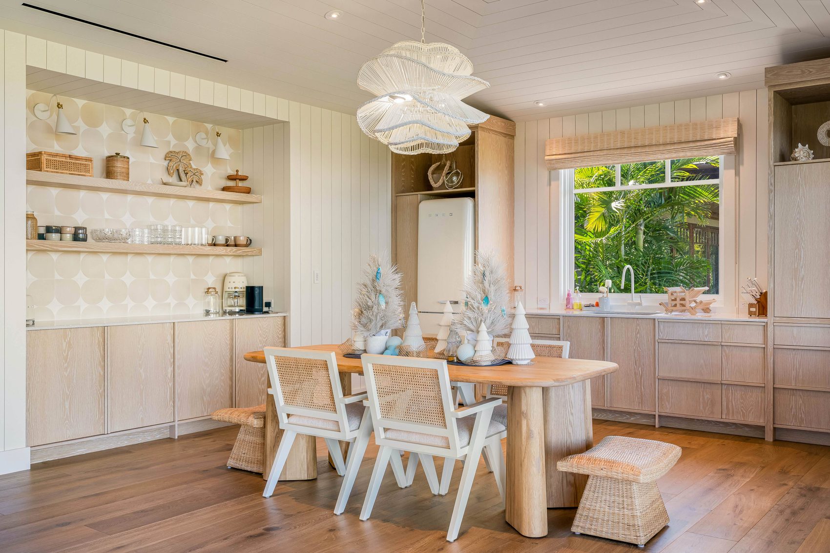 Winter-inspired dining space. White trees and cool-blue accents offer a lighter, coastal take on seasonal table decorating.